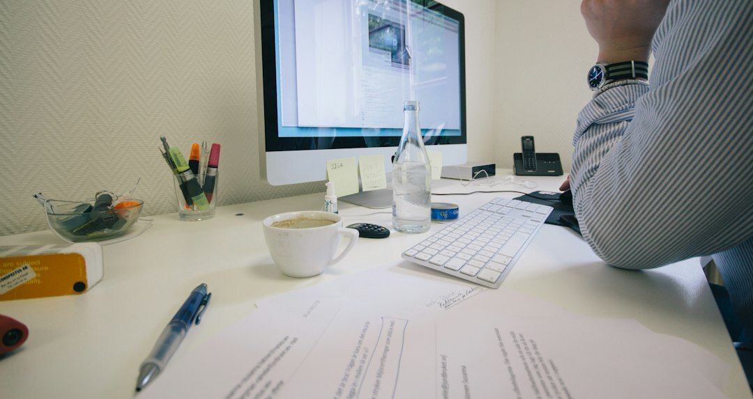 person reviewing financial documents at desk